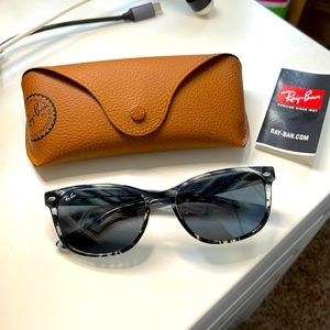 Brand new. Worn once. Ray Ban sunglasses.